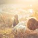 A woman relaxes on a hillside in France
